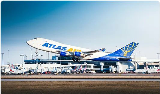 Cargo aircraft at an airport for an article about DAP shipment planning.